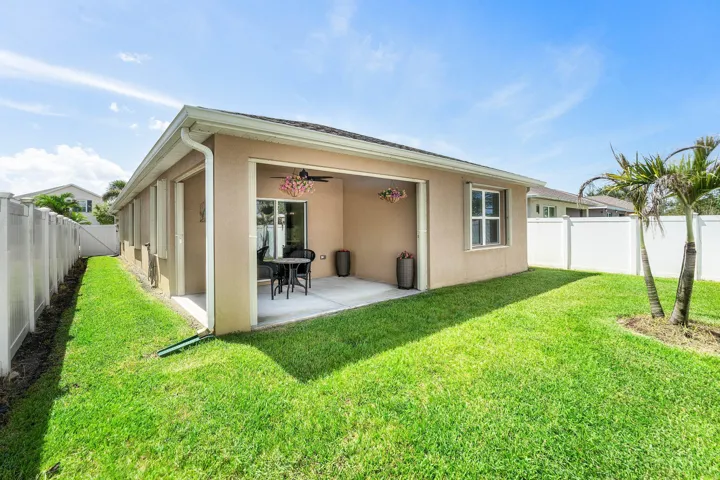 Outdoor patio with ceiling fan & sliding glass door