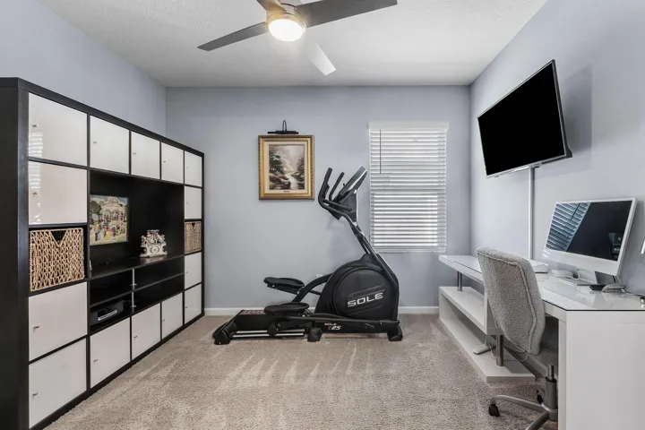 Recessed lighting, ceiling fan, and window with blinds