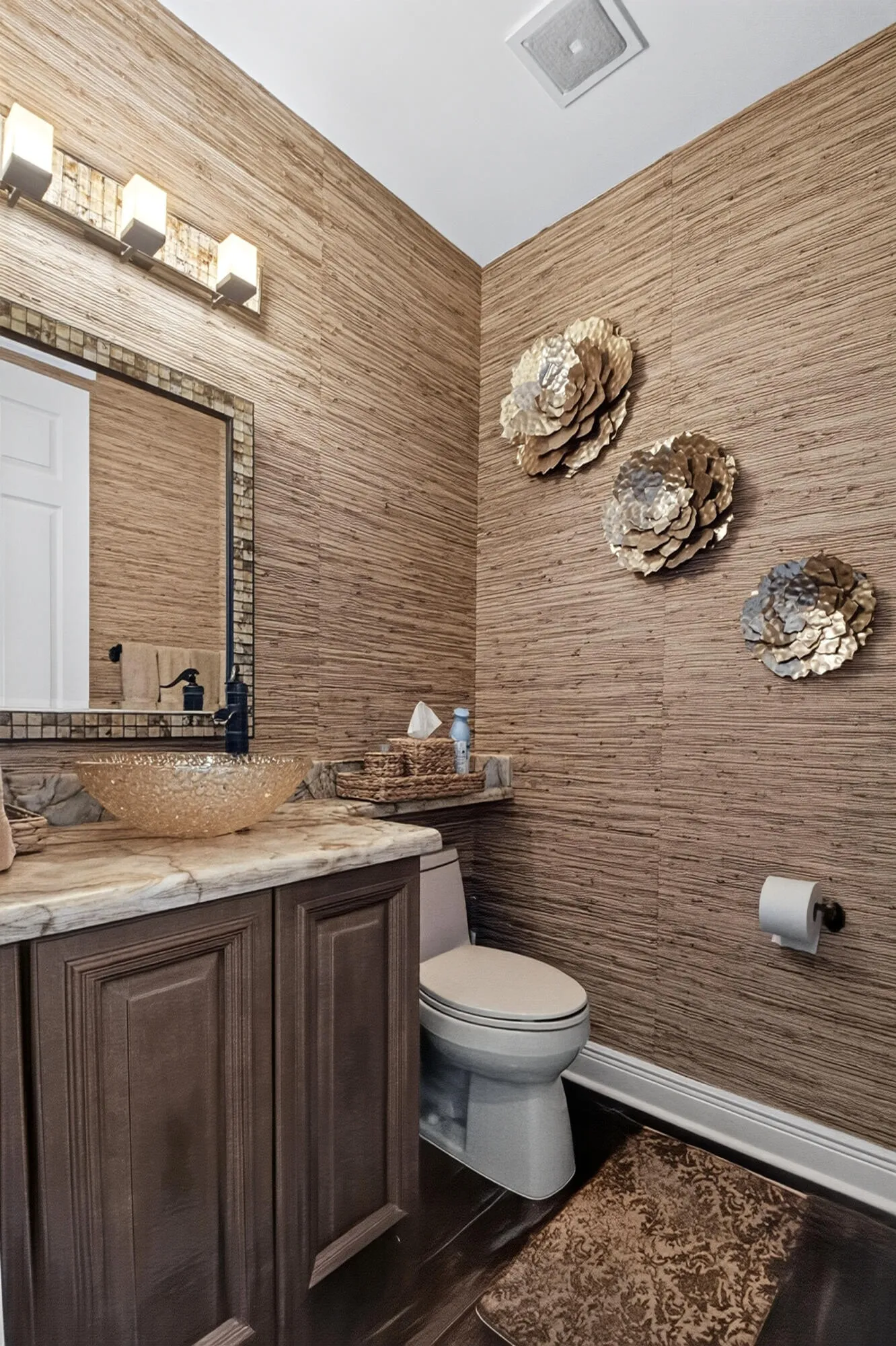 Luxurious Grasscloth Walls & an Onyx Counter which is really beautiful.
