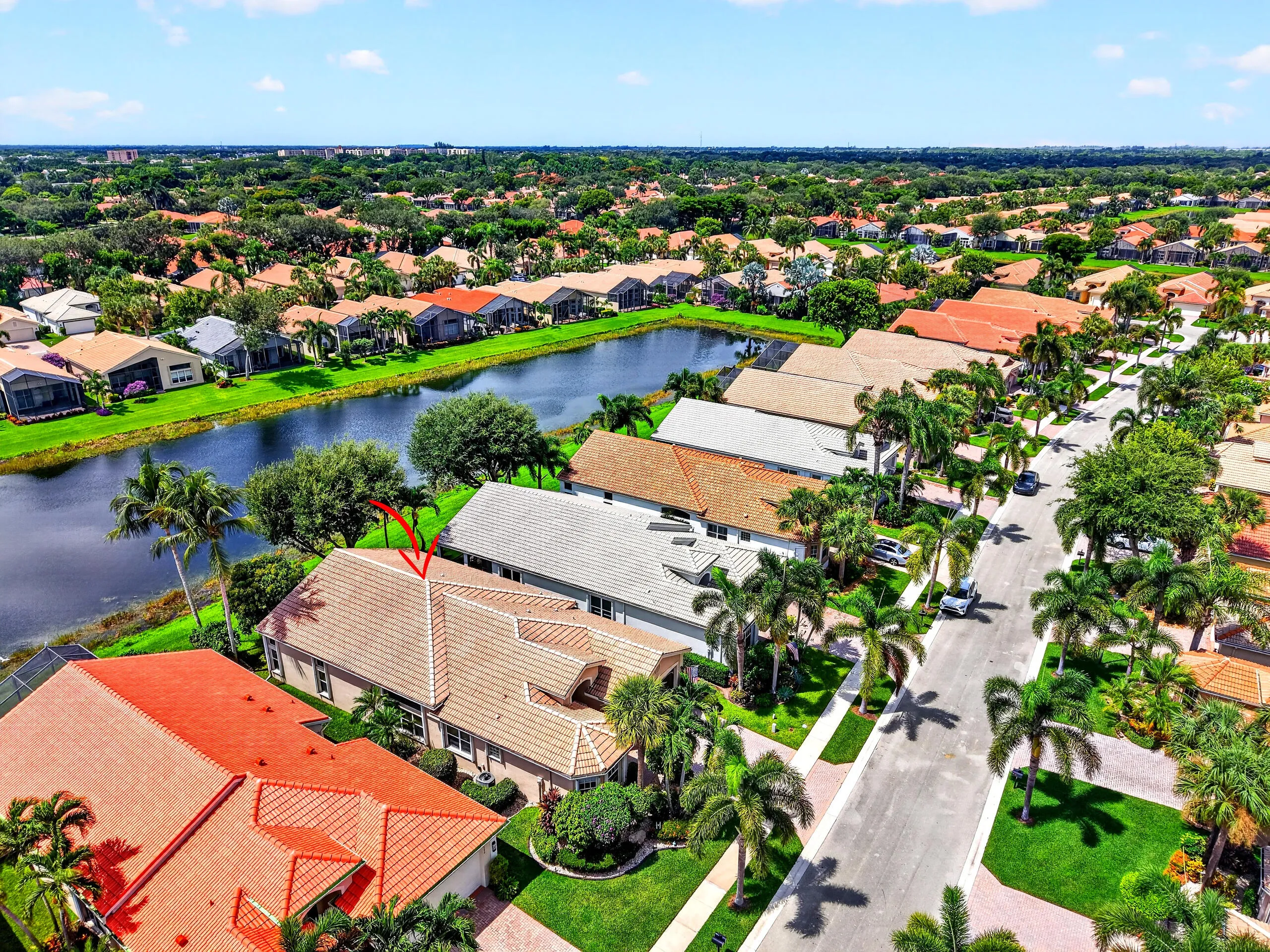 This beautiful tree-lined setting with the lake just beyond, captures the warmth, beauty of this established community