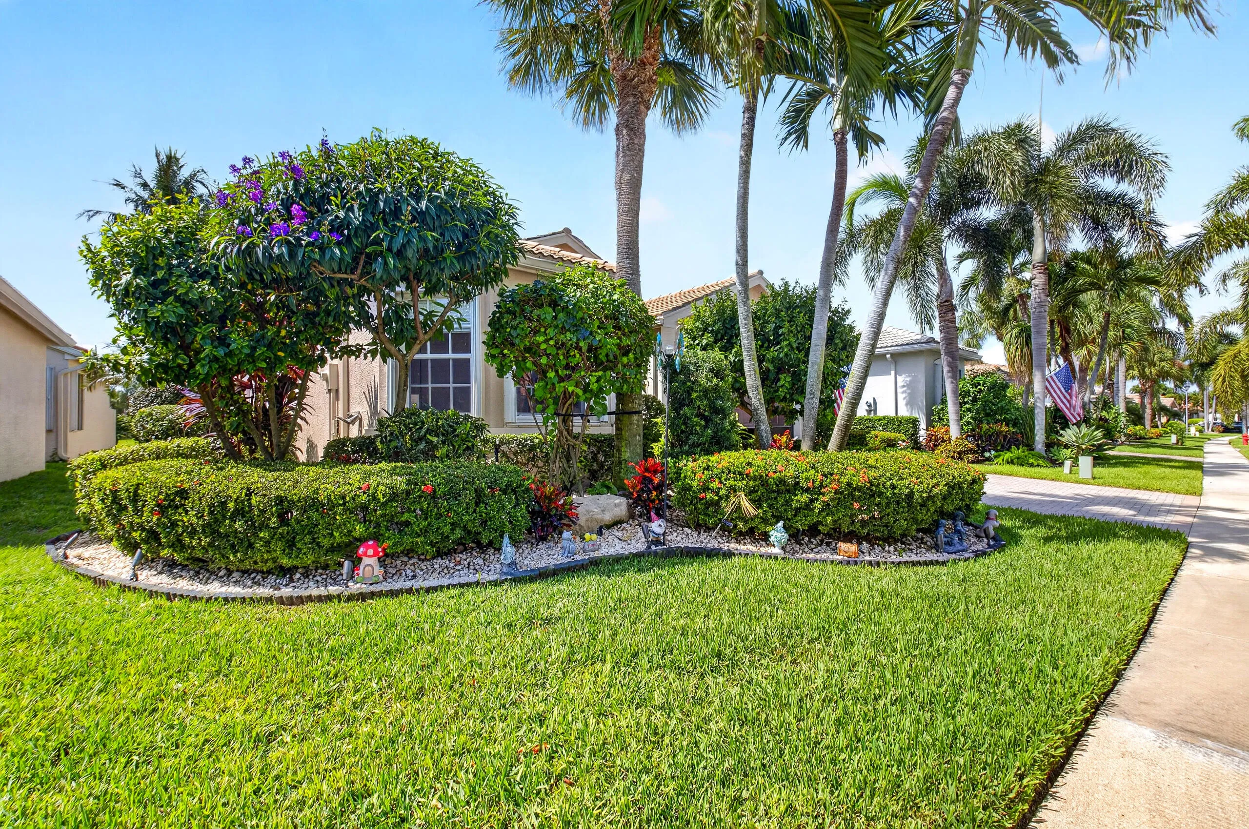 Lush Garden in the Front, Side and Back of this lovely home.