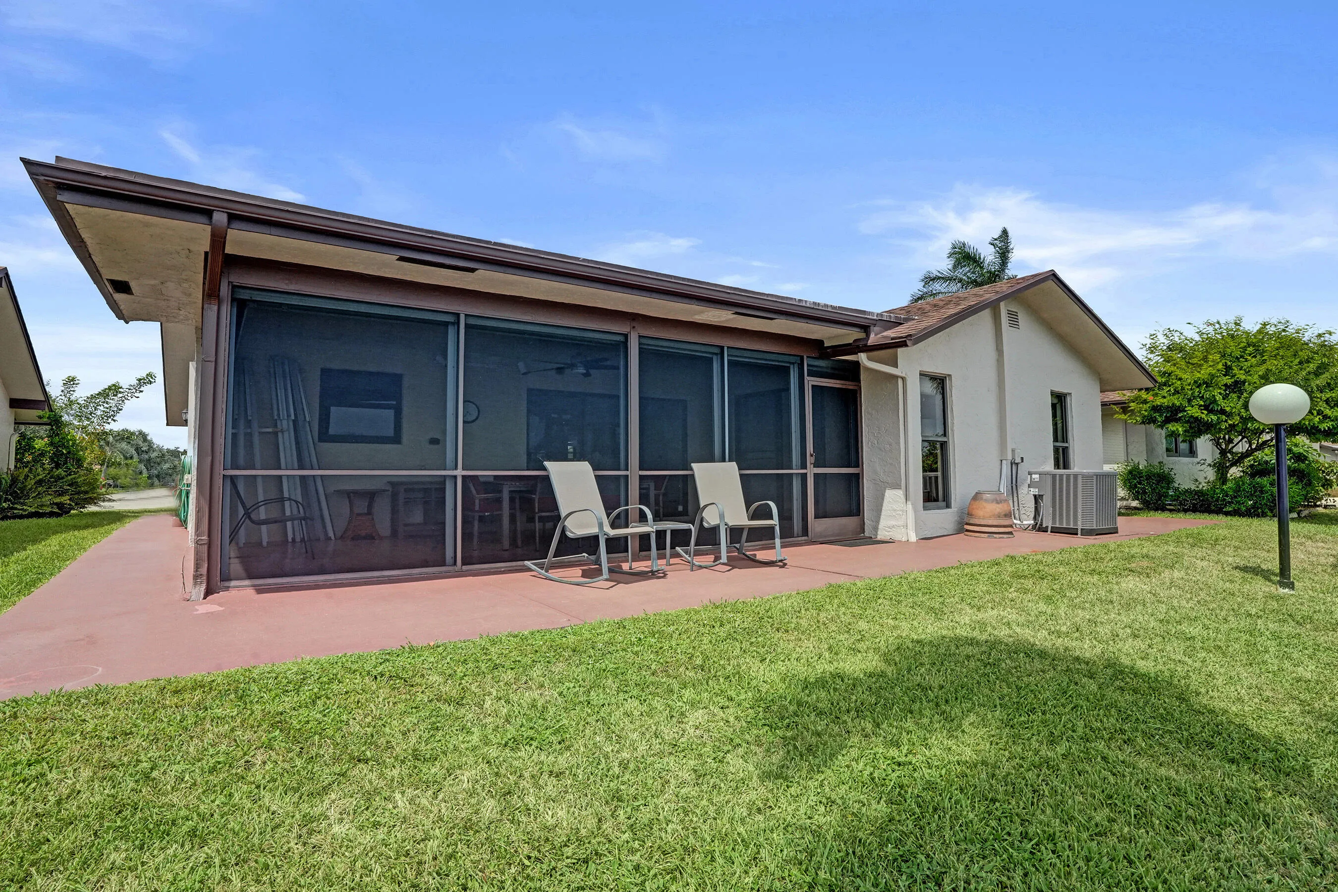 View of the back of the home! Also have a patio outside the screened patio.