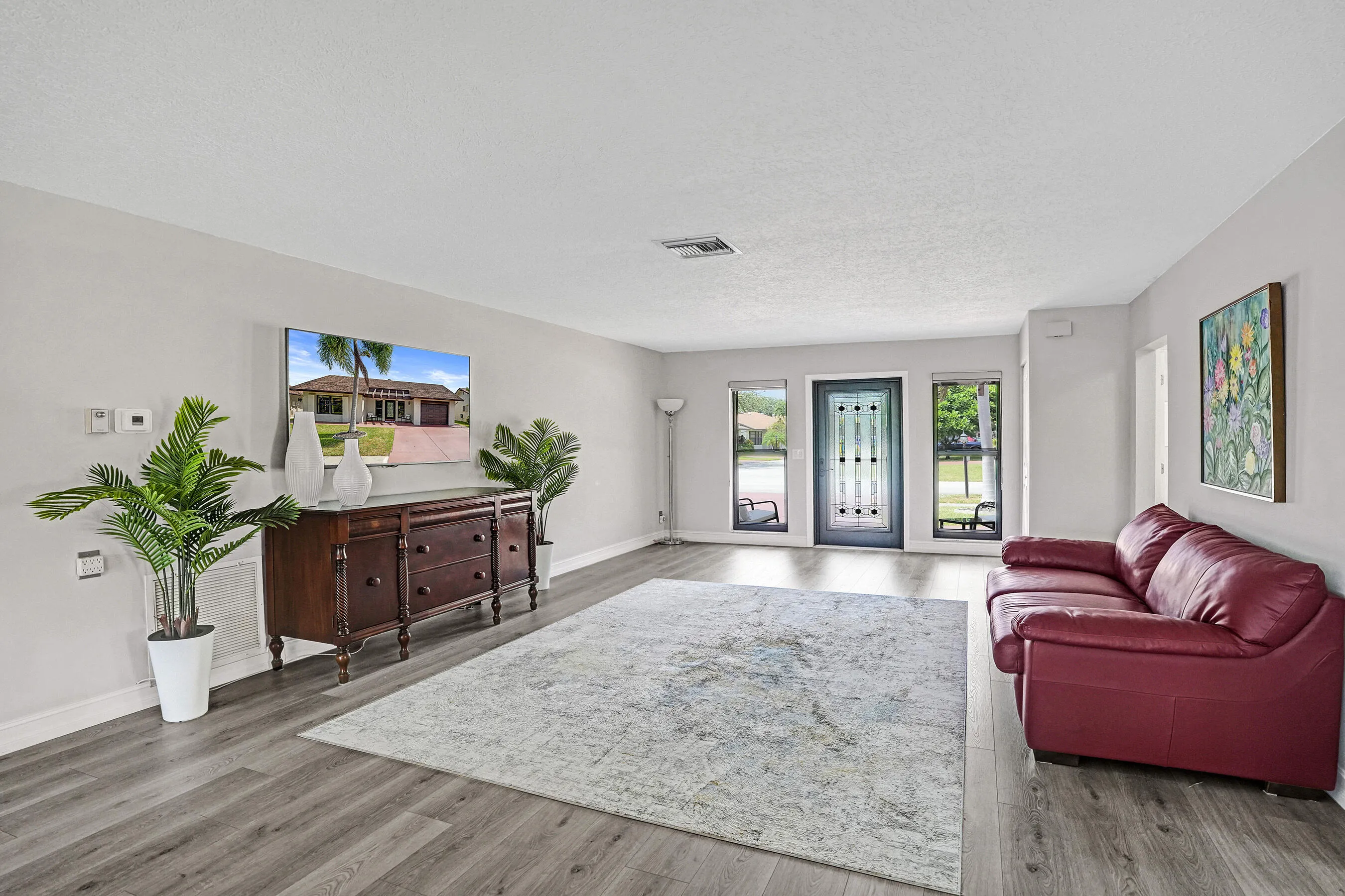 Look at the size of the formal living room and those floors.