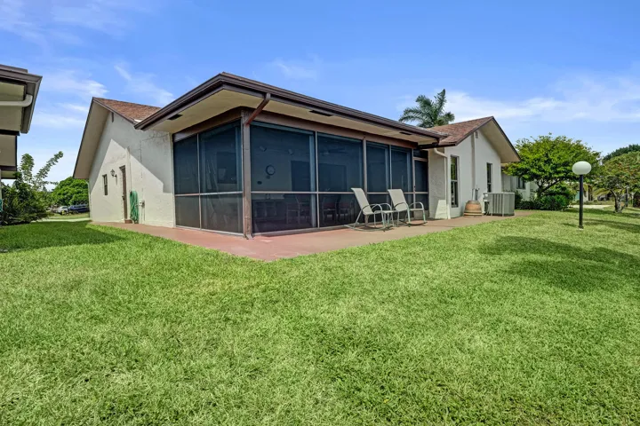 View of the back of the home! Also have a patio outside the screened patio.