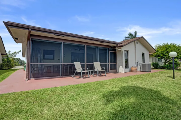 View of the back of the home! Also have a patio outside the screened patio.