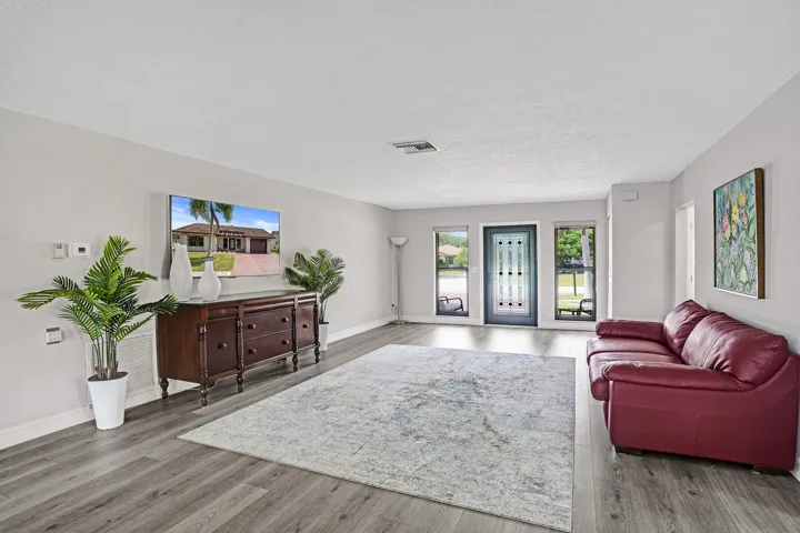 Look at the size of the formal living room and those floors.
