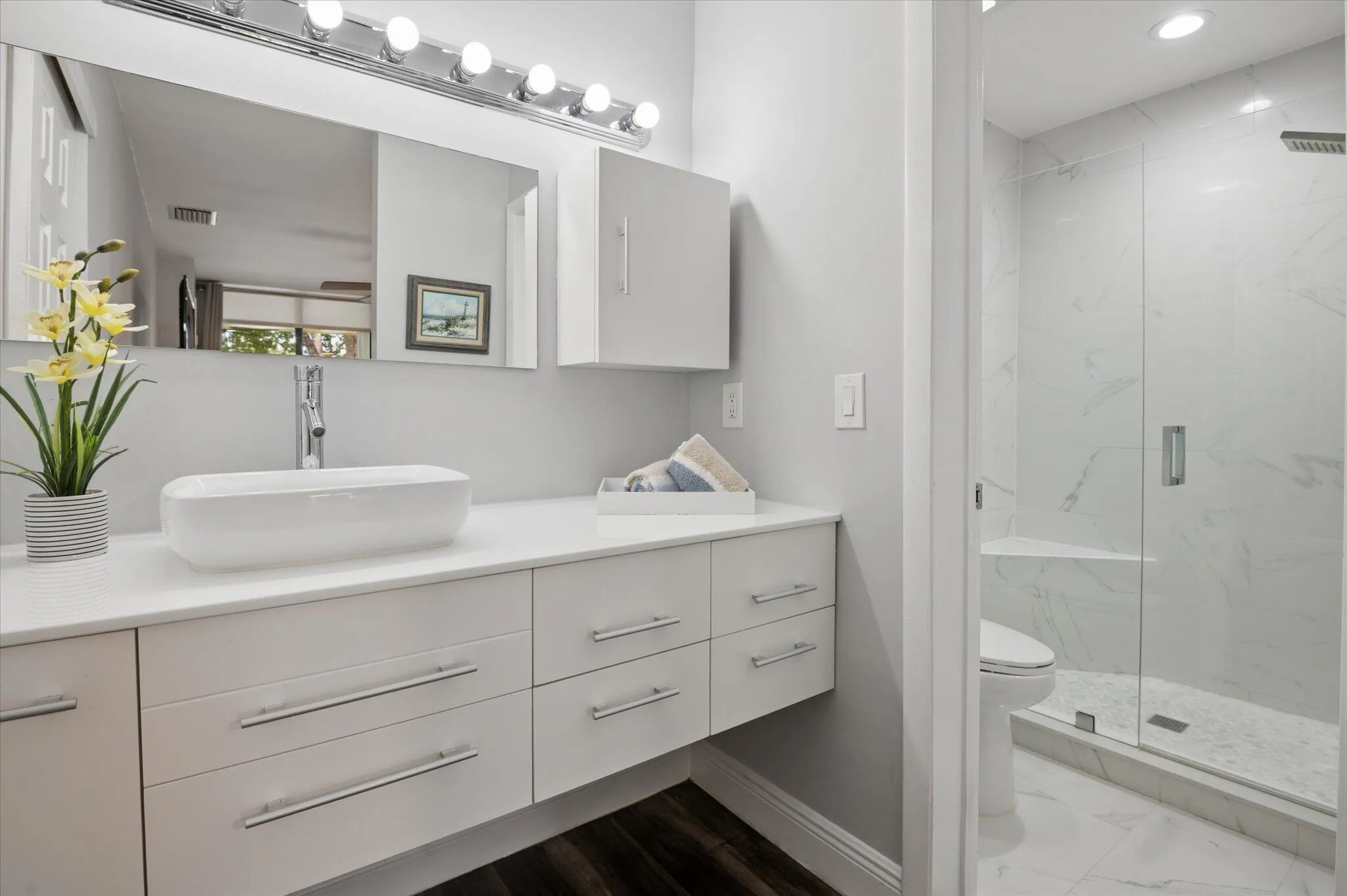 Updated primary bathroom with ample storage and counterspace