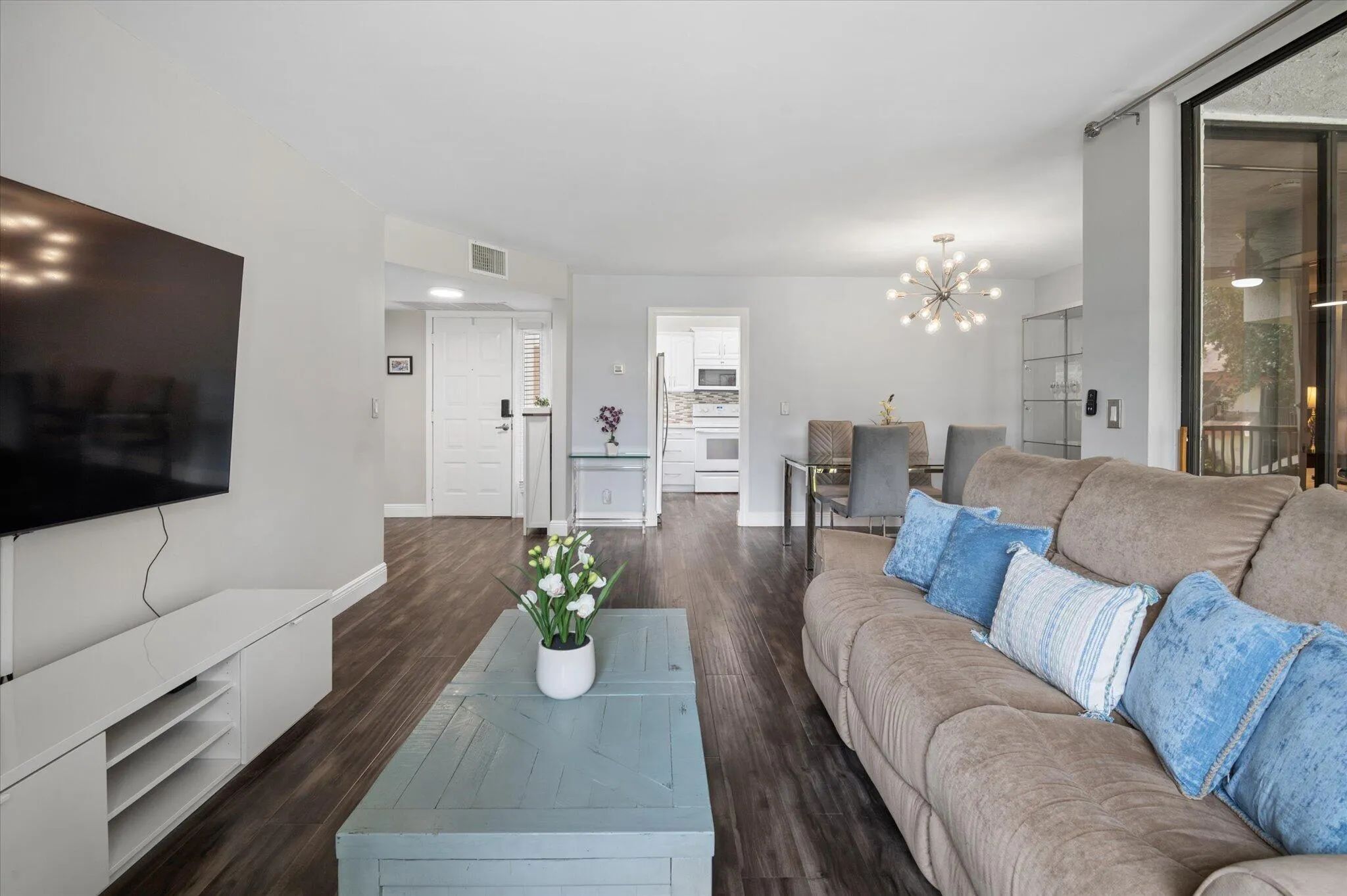 Living room with views to kitchen/dining area