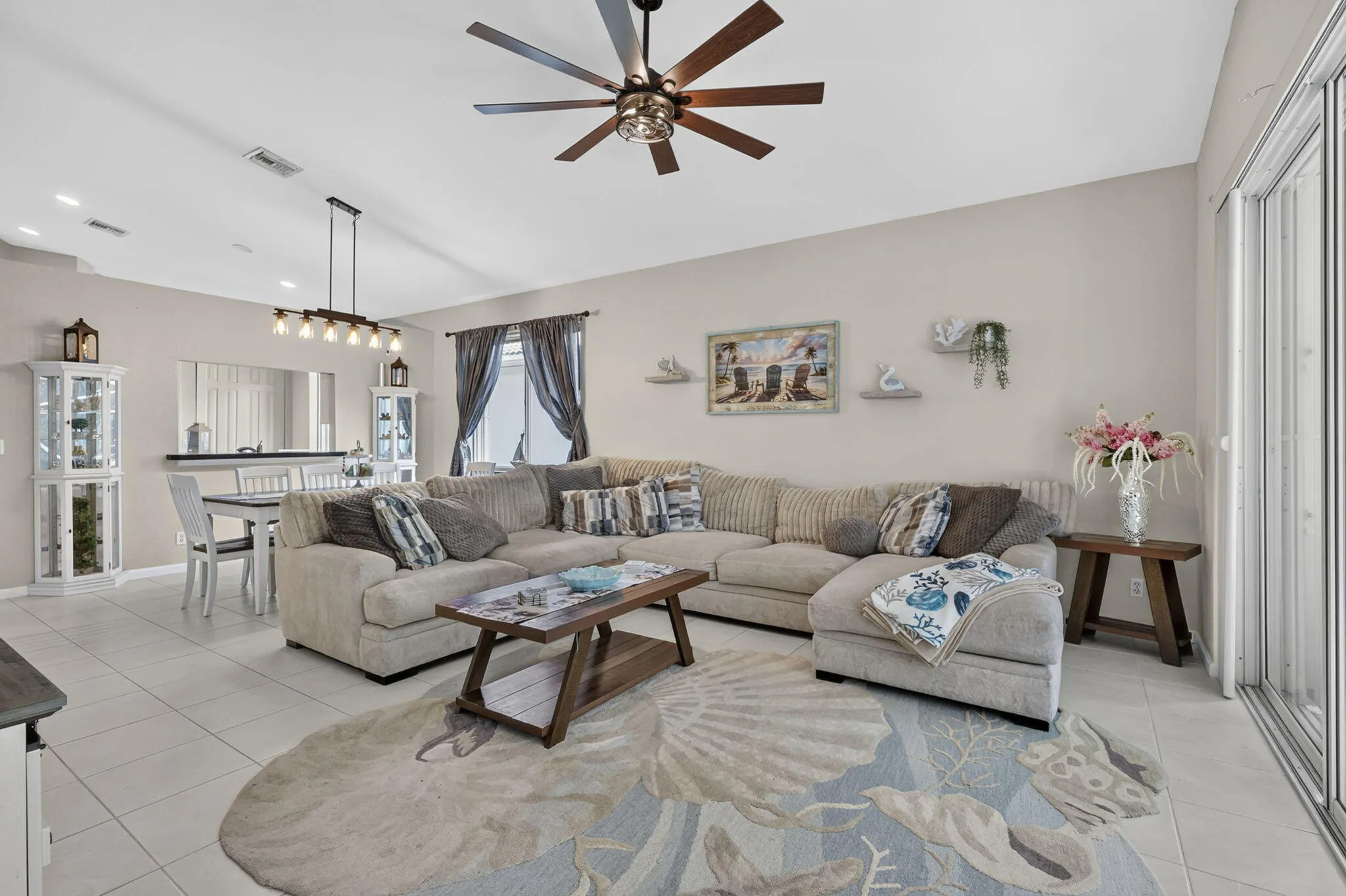 Open concept living and dining area featuring tile flooring