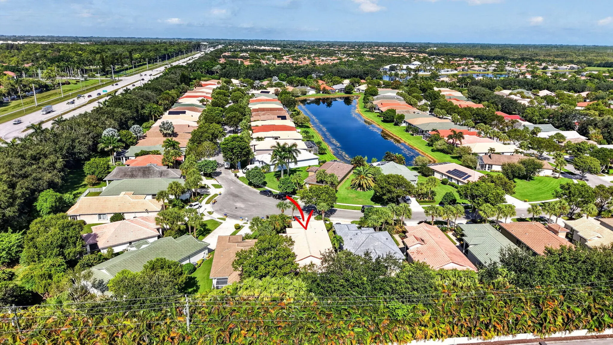 Residential community with established landscaping and a central waterway