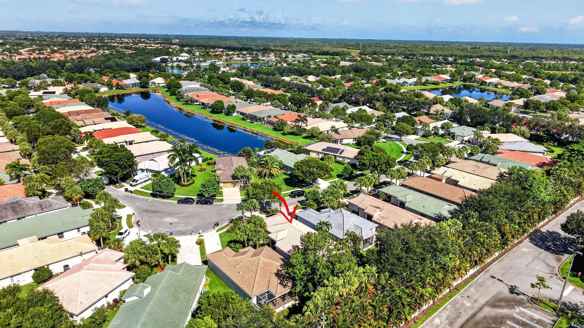 Residential property situated in a community with numerous homes and lush landscaping