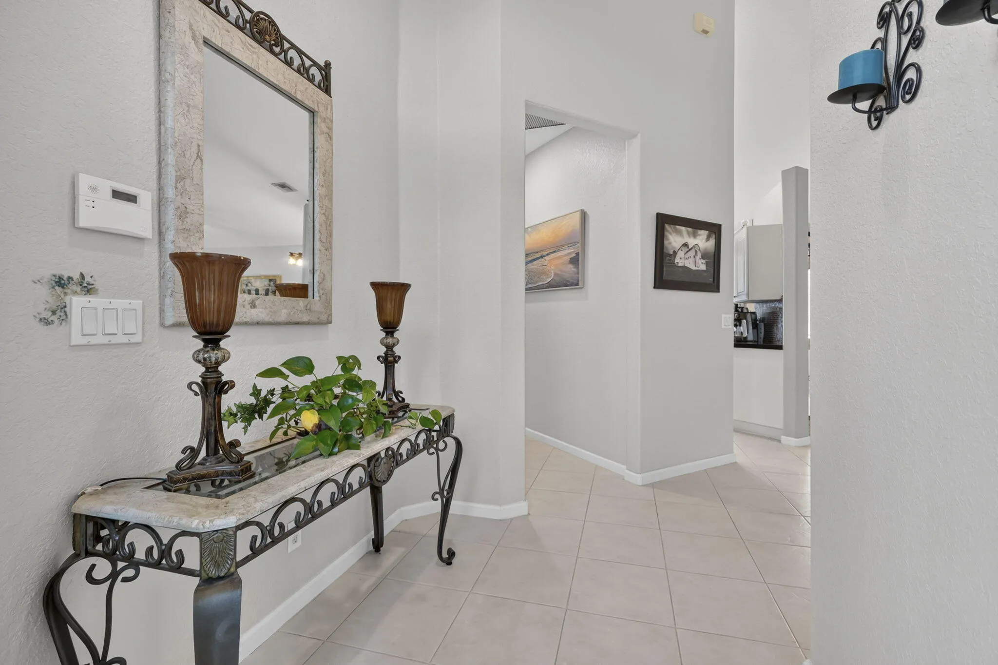 Tiled flooring throughout entryway and hallway