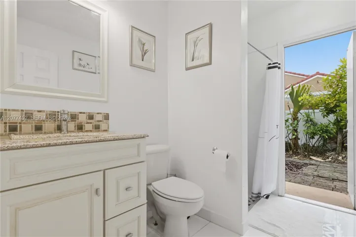 Bathroom # 1 - Cabana with a door to the Backyard.