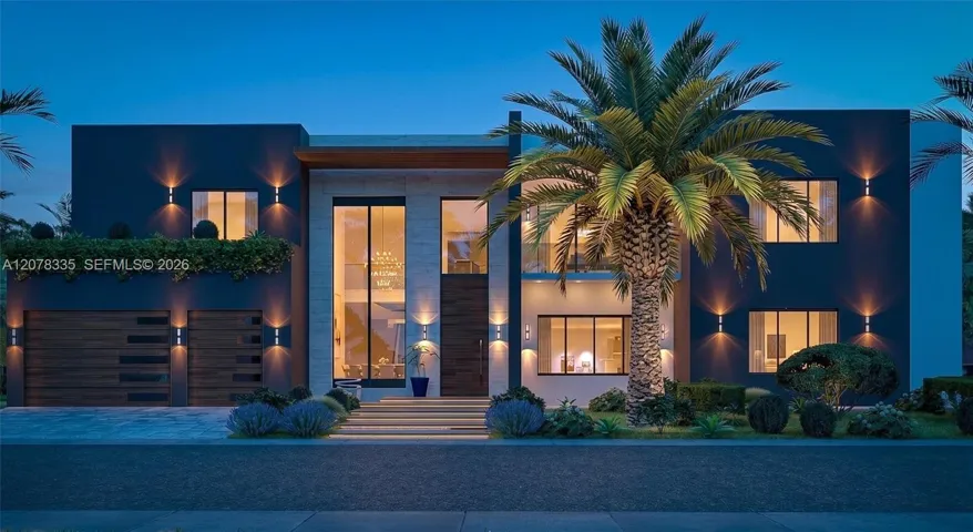 Evening front view highlighting illuminated glass walls, palm trees, and elegant entrance.