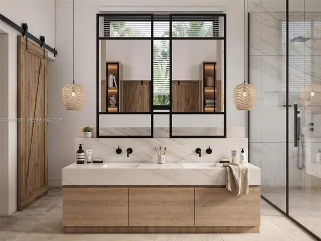 Spa-like bathroom featuring dual vanities, sliding barn door, and round accent mirrors.