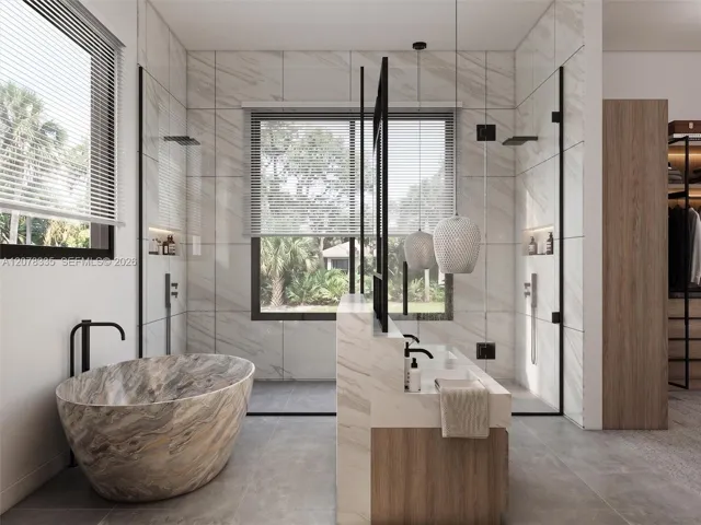 Luxurious bathroom with freestanding soaking tub, glass-enclosed shower, and natural stone finishes.
