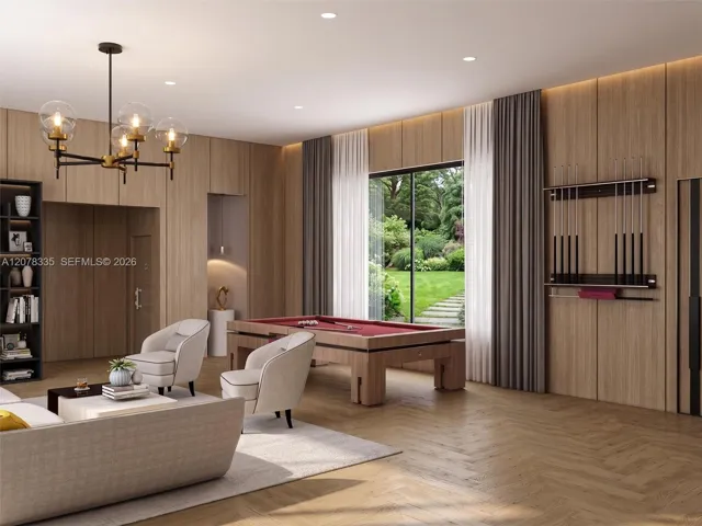 Bright open-concept living room with sleek wood built-ins, elegant chandelier, and pool views.