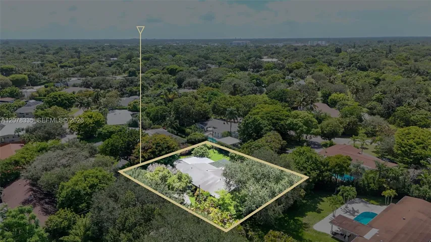 Bird's-eye view capturing the property's private pool, backyard space, and quiet residential setting.