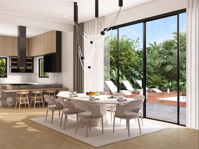 Open-concept dining space adjacent to the modern kitchen, perfect for entertaining guests.