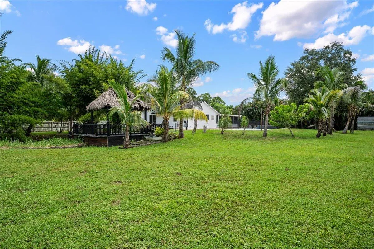 Tucked among mature palms and overlooking the water, the tiki hut feels like your own private Florida hideaway. It’s the kind of setting that makes coming home feel like getting away.