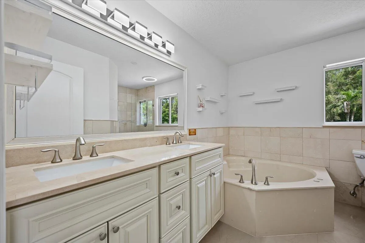 Your own space to slow down and unwind. The ensuite bath pairs a spacious dual-sink vanity with a relaxing soaking tub, creating a private retreat just steps from your bedroom.