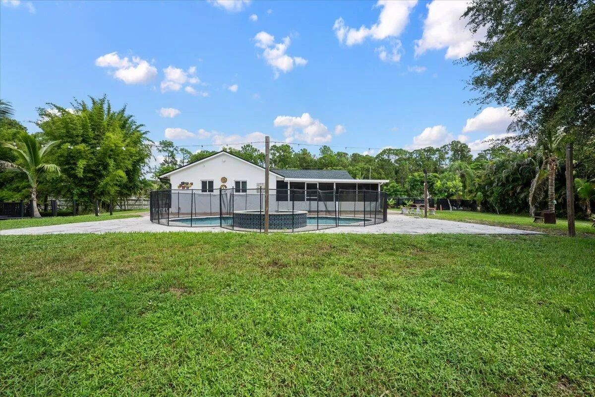 Your own Florida escape is waiting just outside. Cool off in the pool, unwind in the spa, and enjoy the open backyard and tropical surroundings that make every day at home feel a little more like vacation.