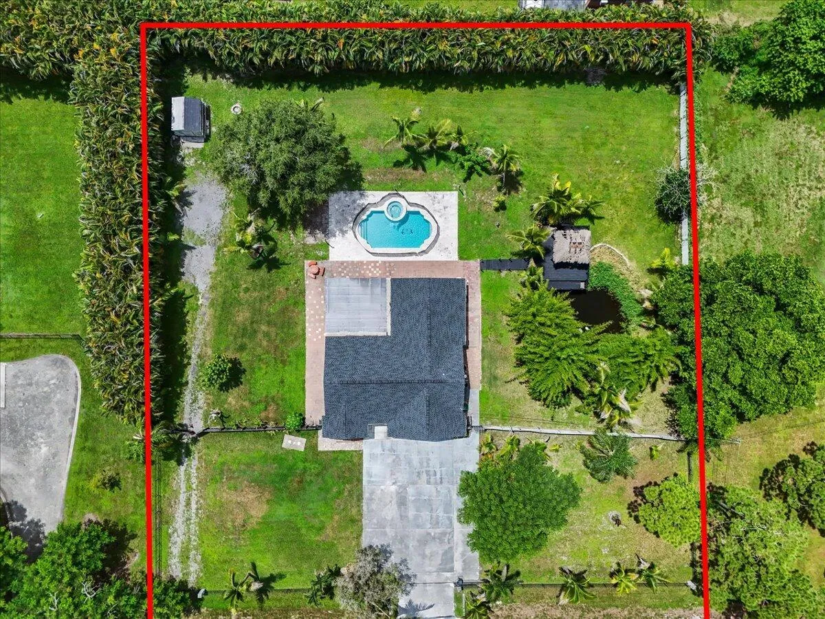 This view tells the story—home, pool, outdoor living, and room to breathe, all on one beautiful property. Approximate property boundaries shown for illustrative purposes only.