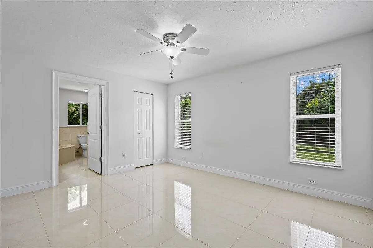 Your private retreat continues with space to settle in and unwind. Multiple windows fill the owner’s suite with natural light, while direct access to the ensuite completes the comfortable, connected layout