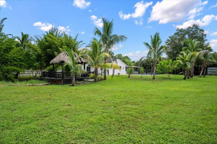 Tucked among mature palms and overlooking the water, the tiki hut feels like your own private Florida hideaway. It’s the kind of setting that makes coming home feel like getting away.