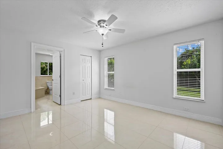Your private retreat continues with space to settle in and unwind. Multiple windows fill the owner’s suite with natural light, while direct access to the ensuite completes the comfortable, connected layout
