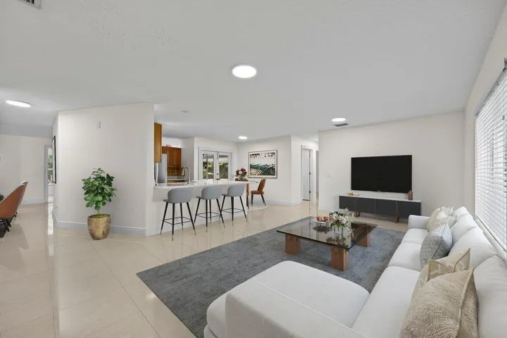 Where everyday moments start to feel like home. The open-concept living space flows effortlessly into the kitchen and dining areas, creating an inviting setting for quiet mornings, relaxed evenings, and everything in between.