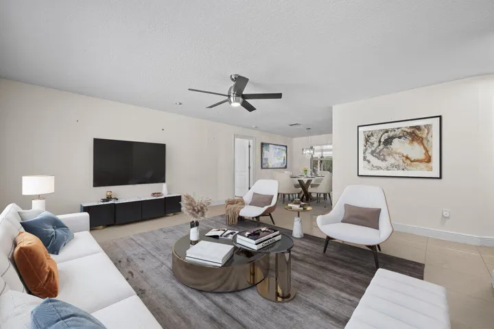 Step inside and feel right at home in this bright, inviting living space designed for both relaxing and gathering. With an open flow into the dining area, it’s a space that makes everyday living—and welcoming guests—feel effortless.