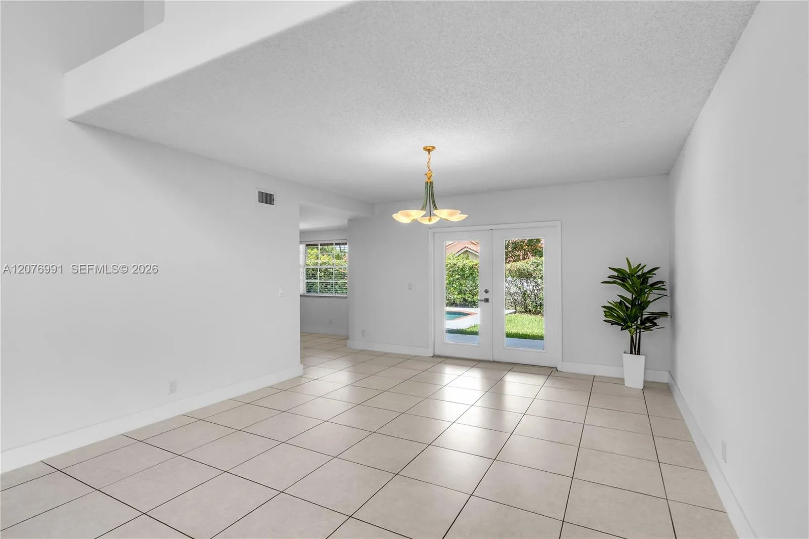 Living - Dining Room French doors lead to outside terrace