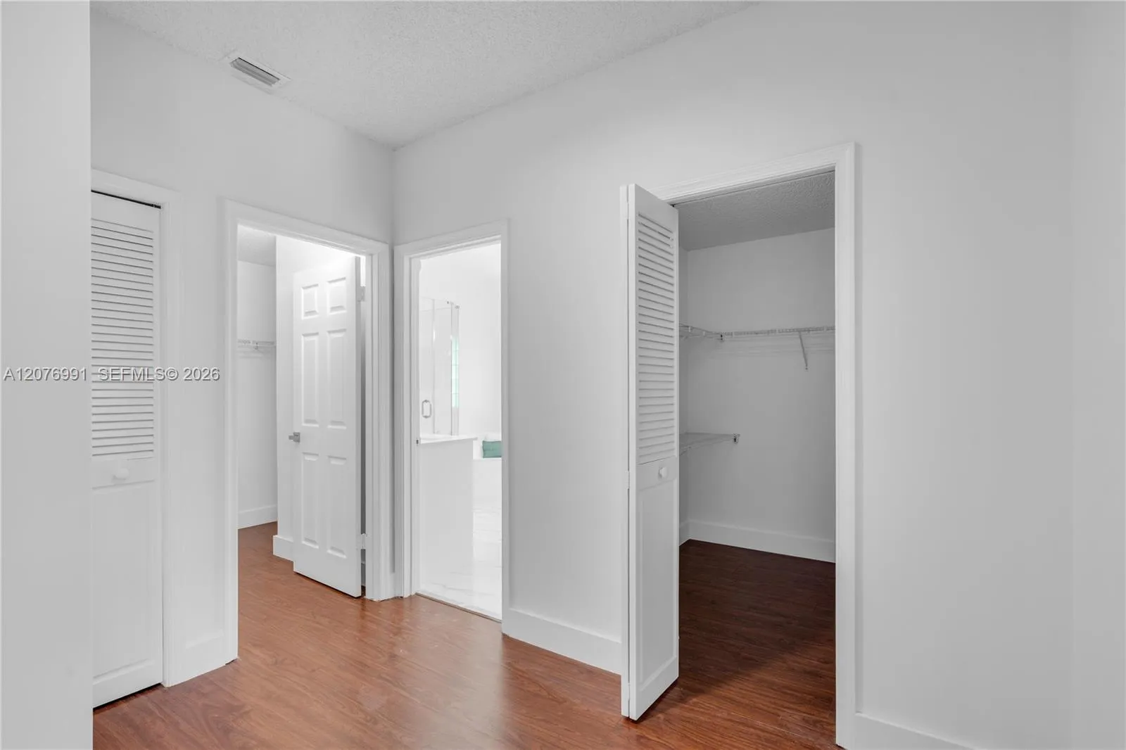 Primary ensuite feautres 2 walk-in closets