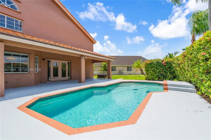 Covered terrace overlooks pool