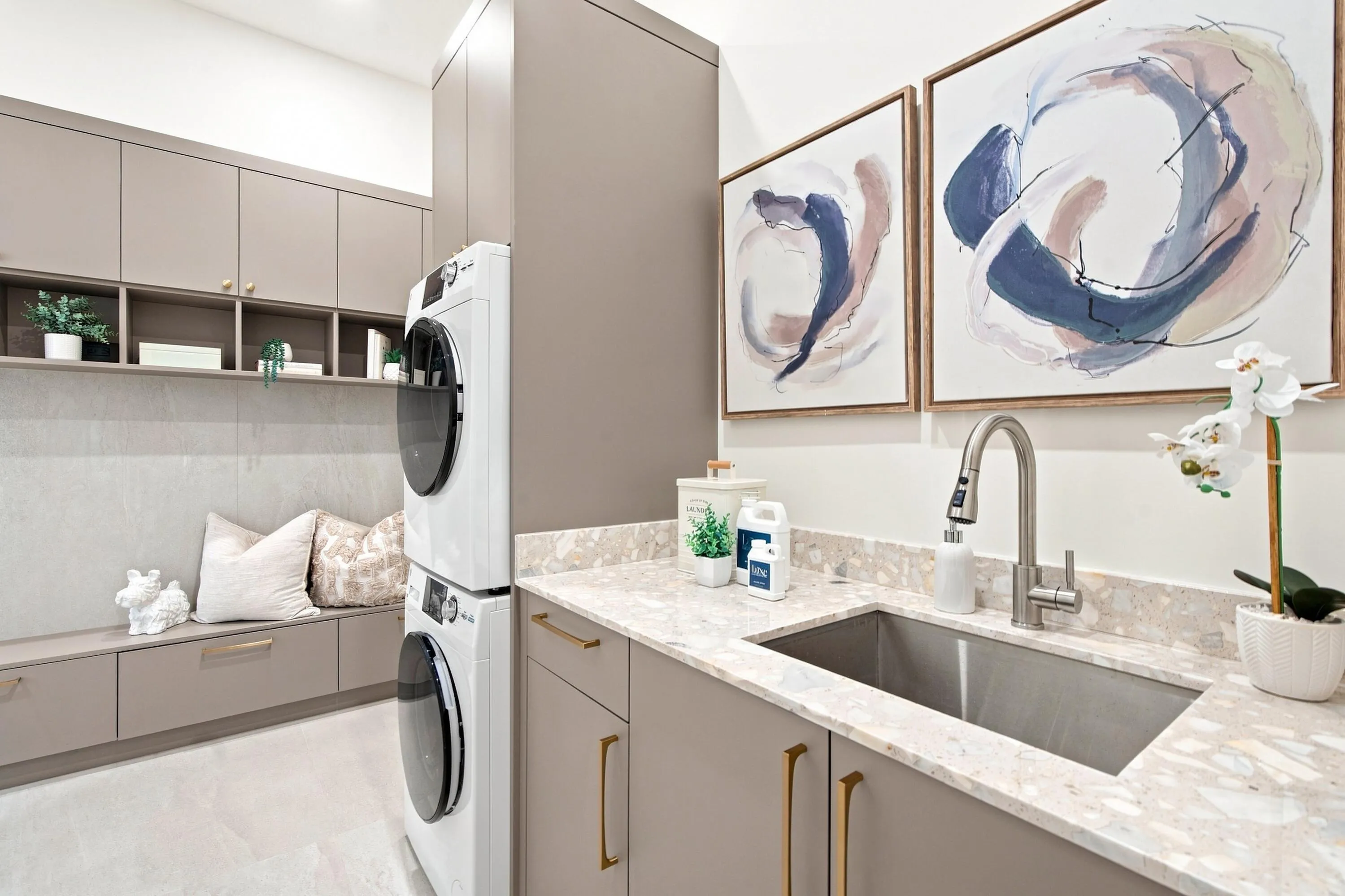 Built-in cabinetry, under-cabinet shelving, integrated bench seating, and an undermount sink with a pull-down faucet
