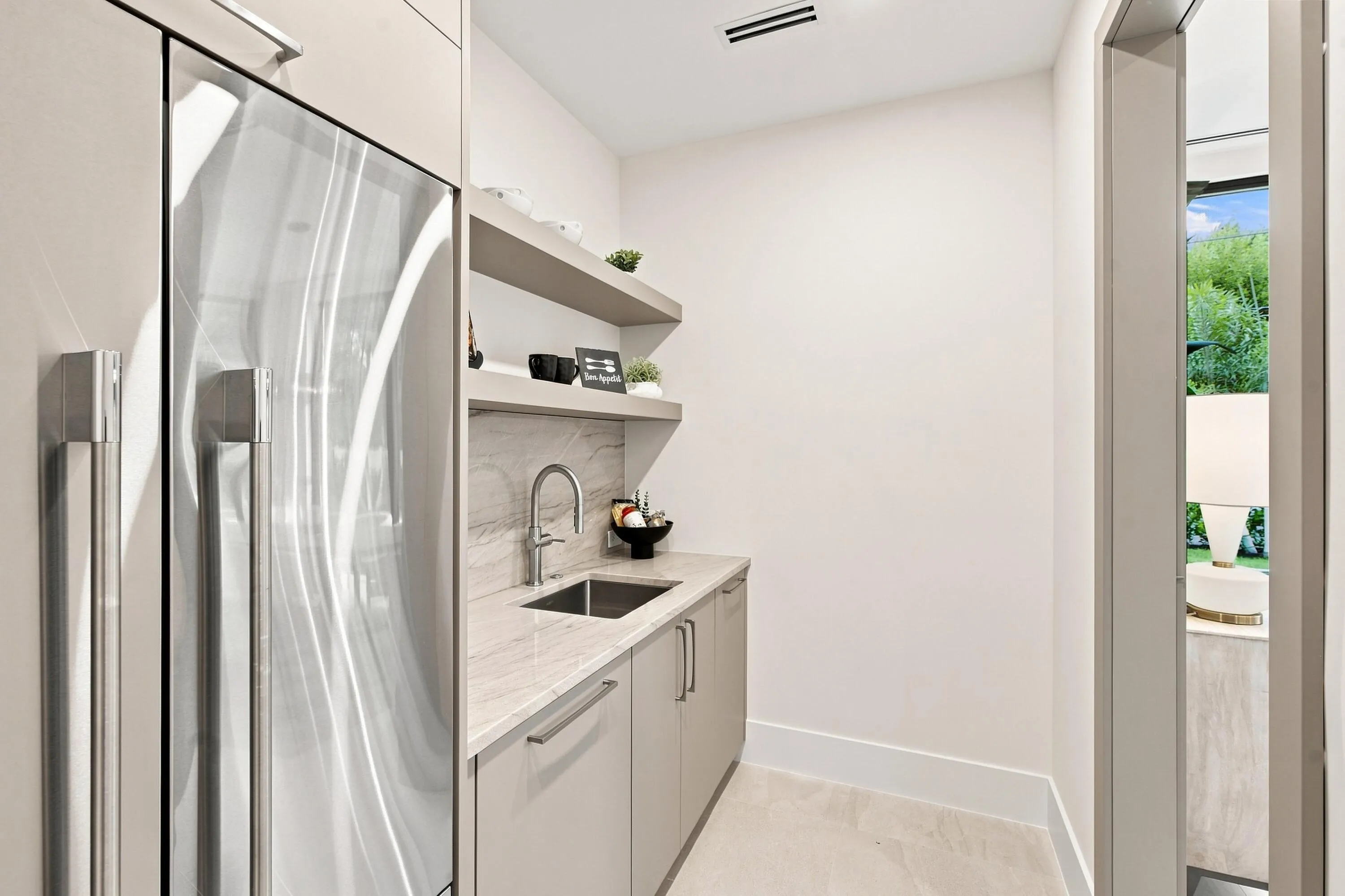Built-in stainless steel refrigerator and custom cabinetry