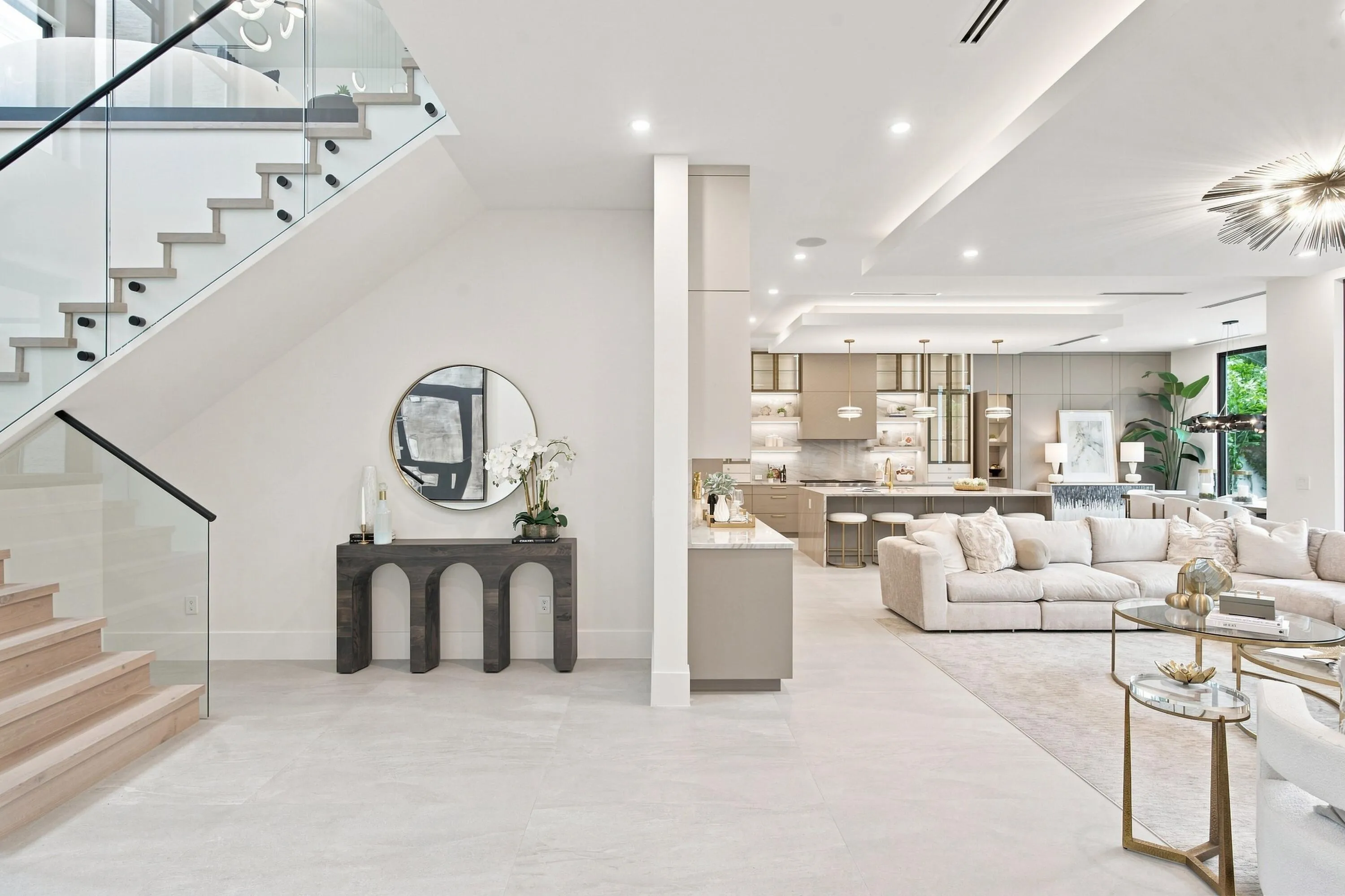 Contemporary open-concept living space with light-tone flooring