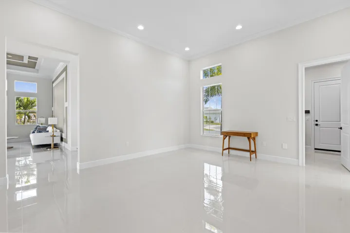 Flex Room with polished tile flooring, recessed lighting, crown molding, and multiple windows