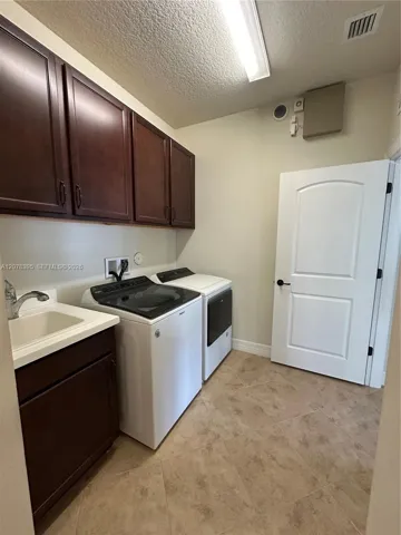 Additional sink and cabinetry for storage