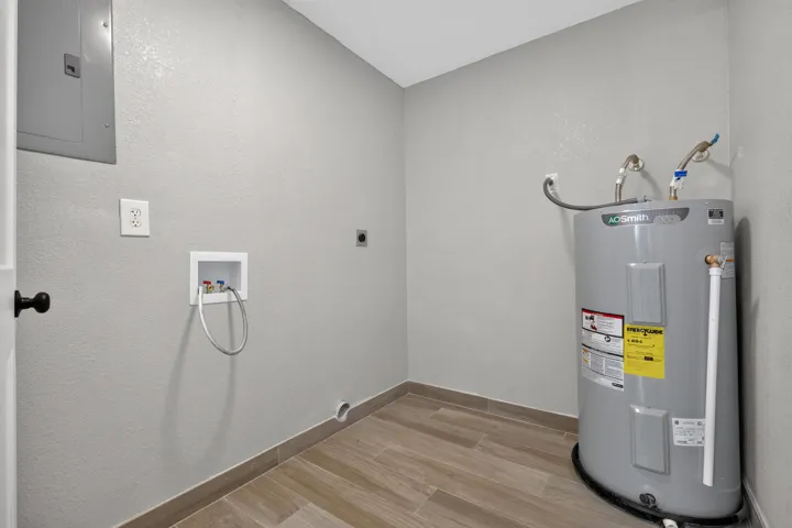 Laundry with washer and dryer hook up.