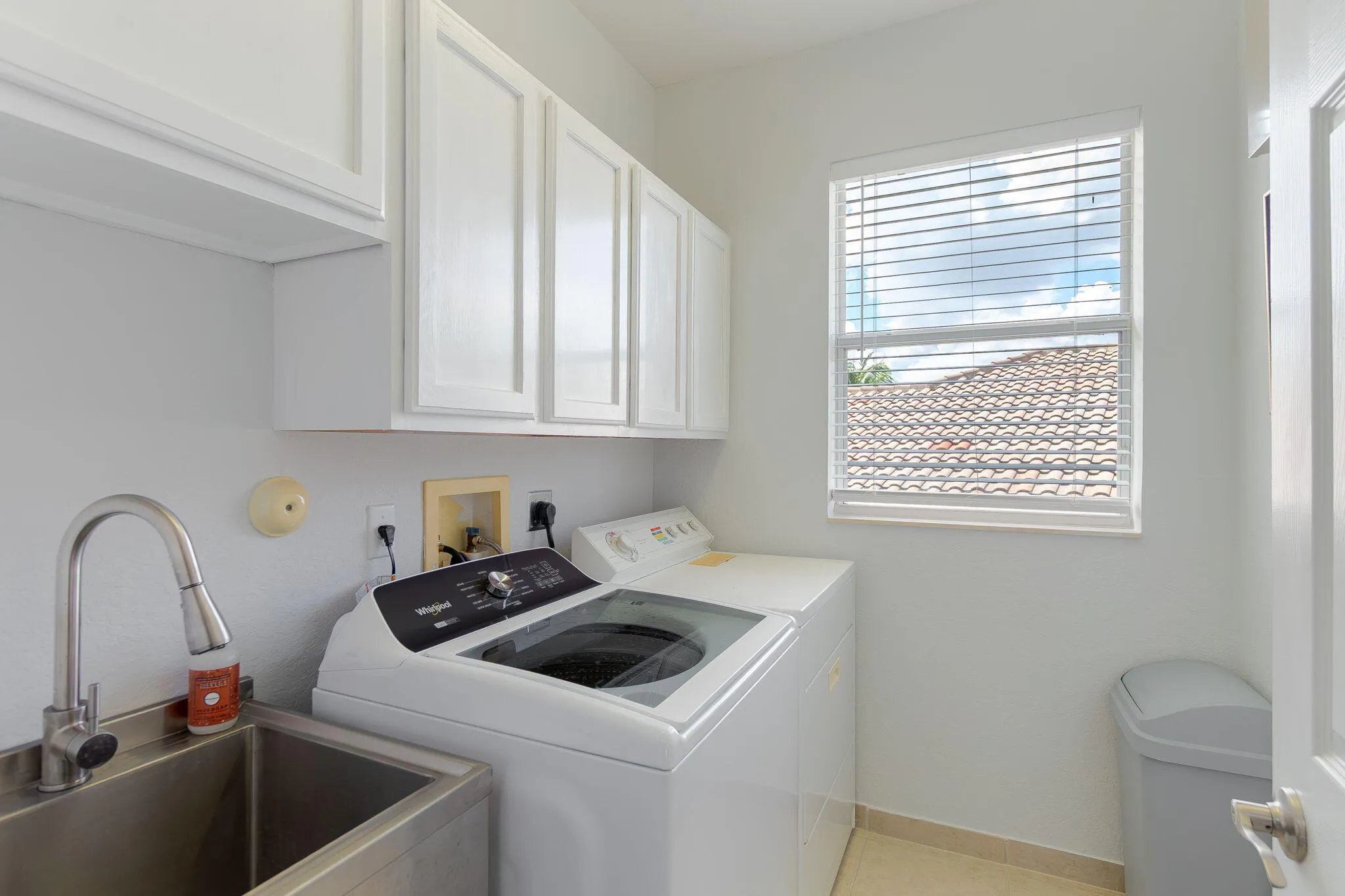Convenient utility sink and new washer in laundry room!