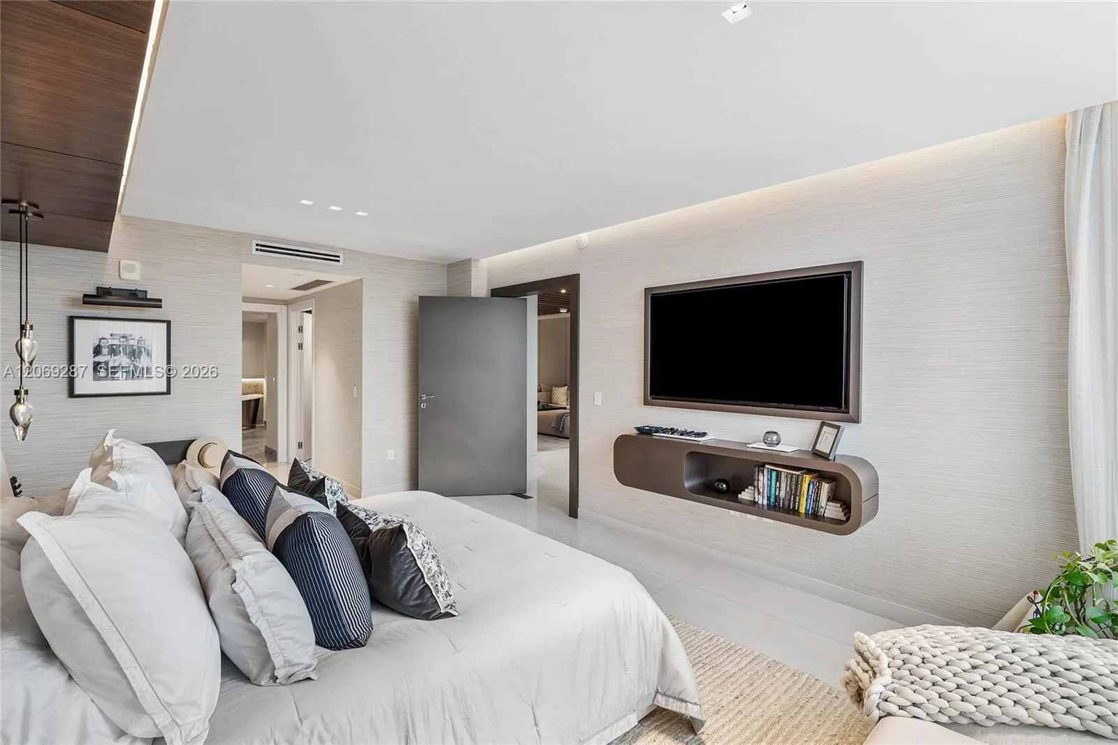 The primary suite is privately positioned at the opposite end of the residence, separate from the additional bedrooms.