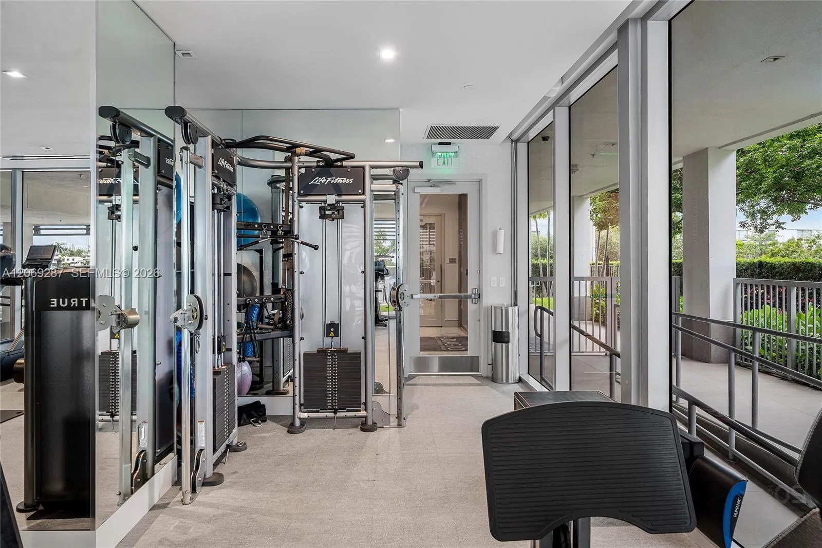 A private, state-of-the-art fitness center featuring premium equipment in an intimate setting.