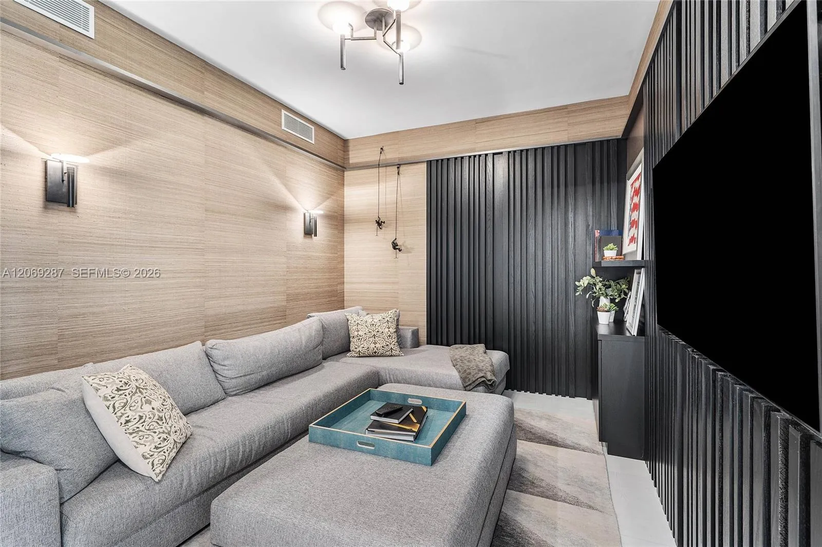 A versatile den offering an intimate setting for a home office, media room or guest retreat.