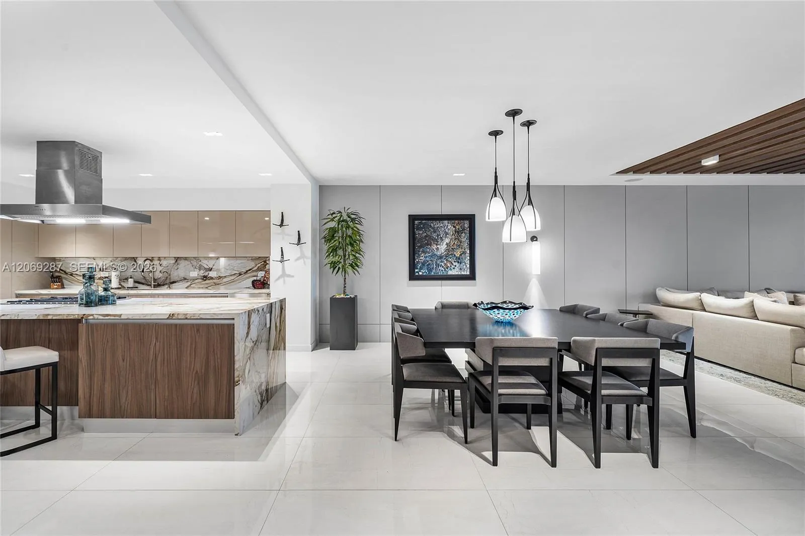 An elegant dining area offering beautiful waterfront views and a seamless setting for entertaining.