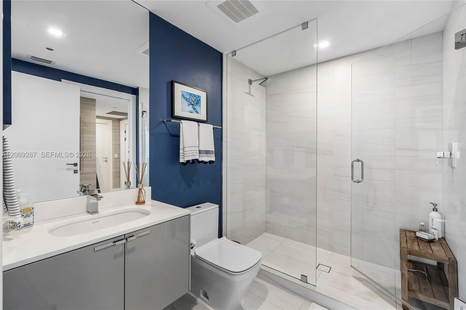 A beautifully appointed second bedroom with a private en-suite bathroom