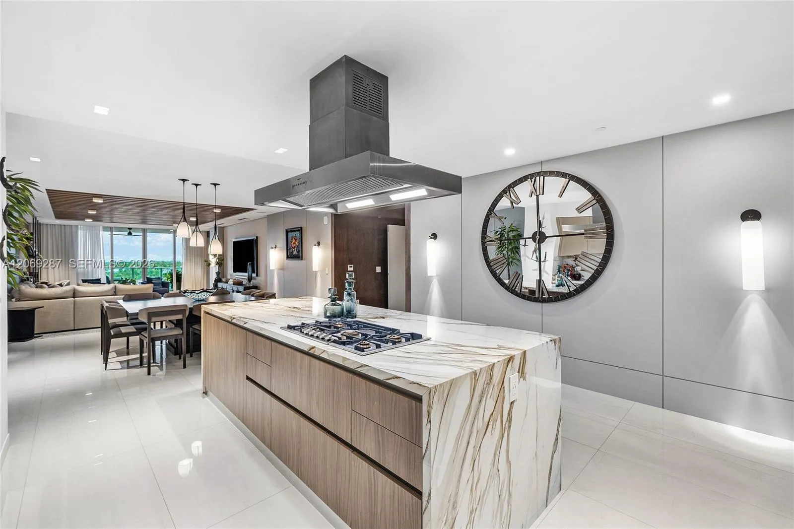 A sophisticated Italian-designed kitchen featuring custom cabinetry, premium Gaggenau appliances, gas cooking and an elegant island ideal for entertaining.