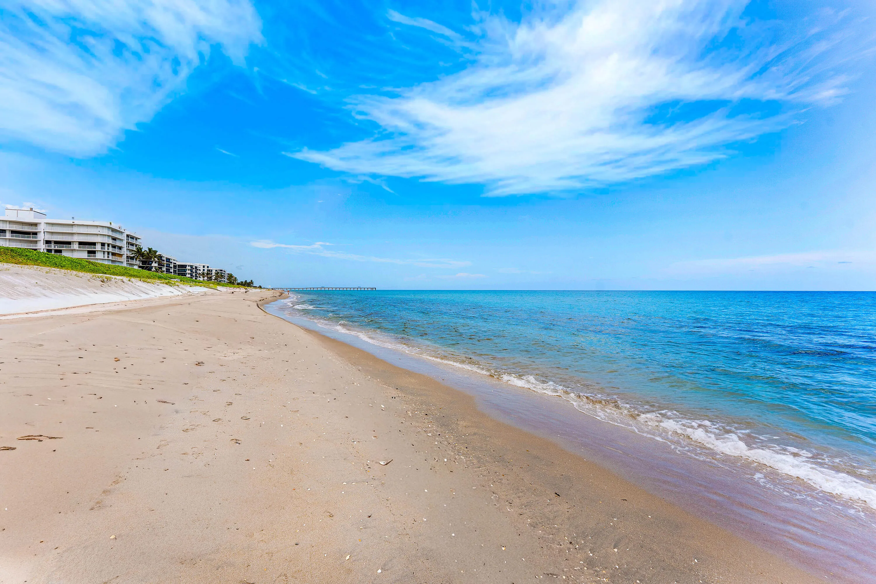 Private beachfront with pristine sandy shoreline and direct water access