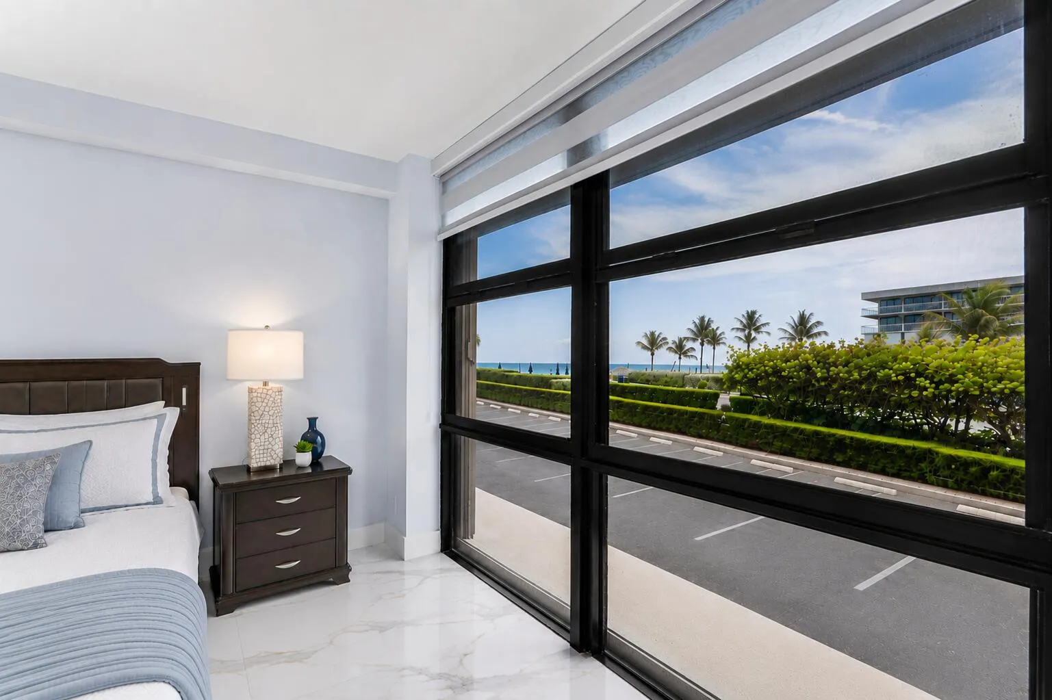 Expansive floor-to-ceiling windows with designer shades and ocean & intracoastal views.
